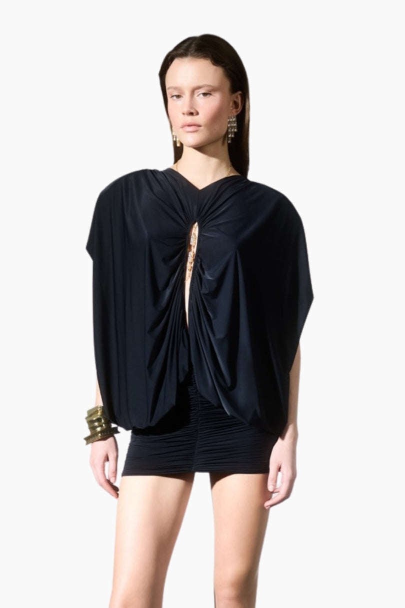 Draped mini dress. Featuring statement shoulders and a bold front cut-out detail. Designed with a bodycon draped mini skirt to highlight a feminine silhouette.