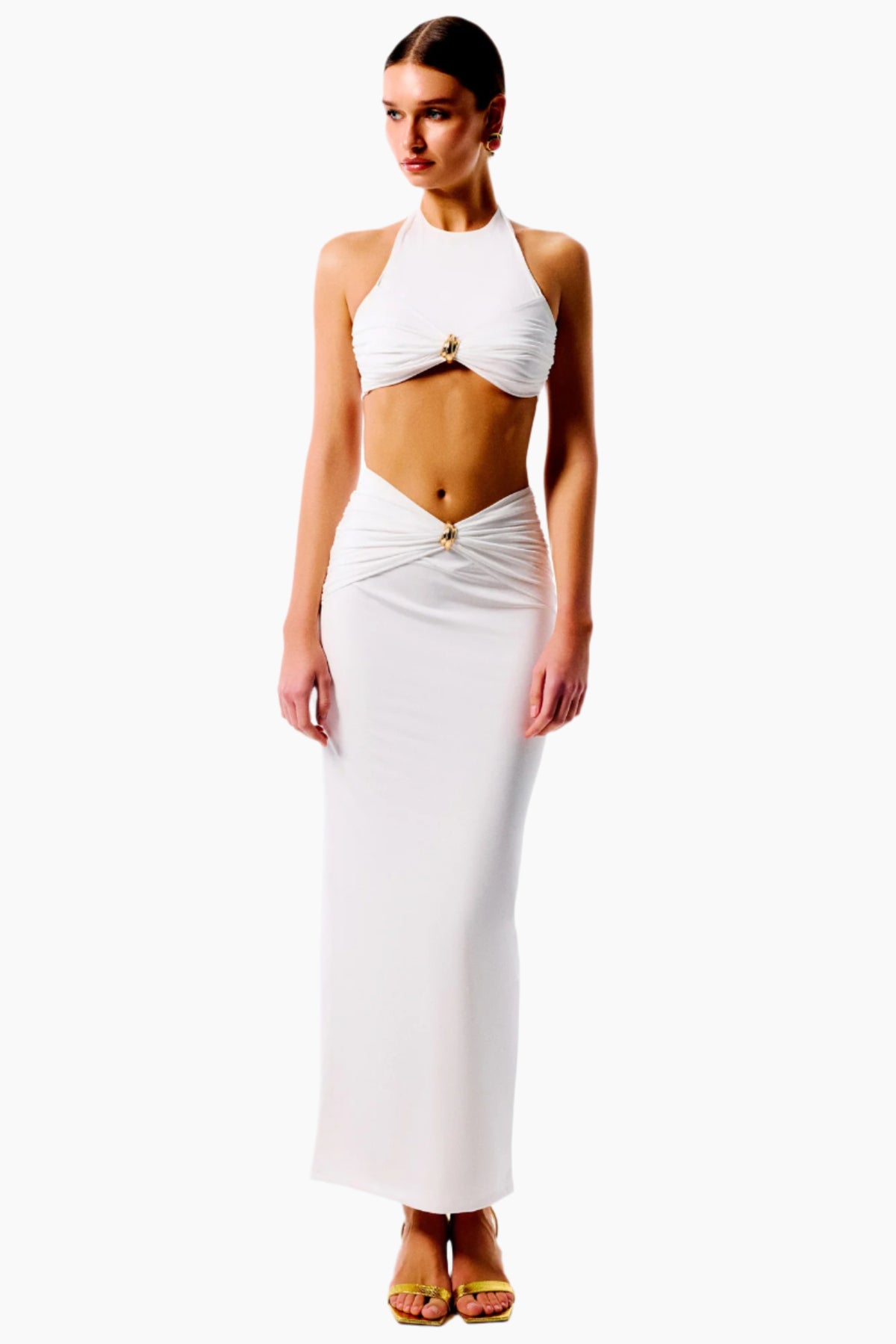 Woman wearing a white halter top and skirt