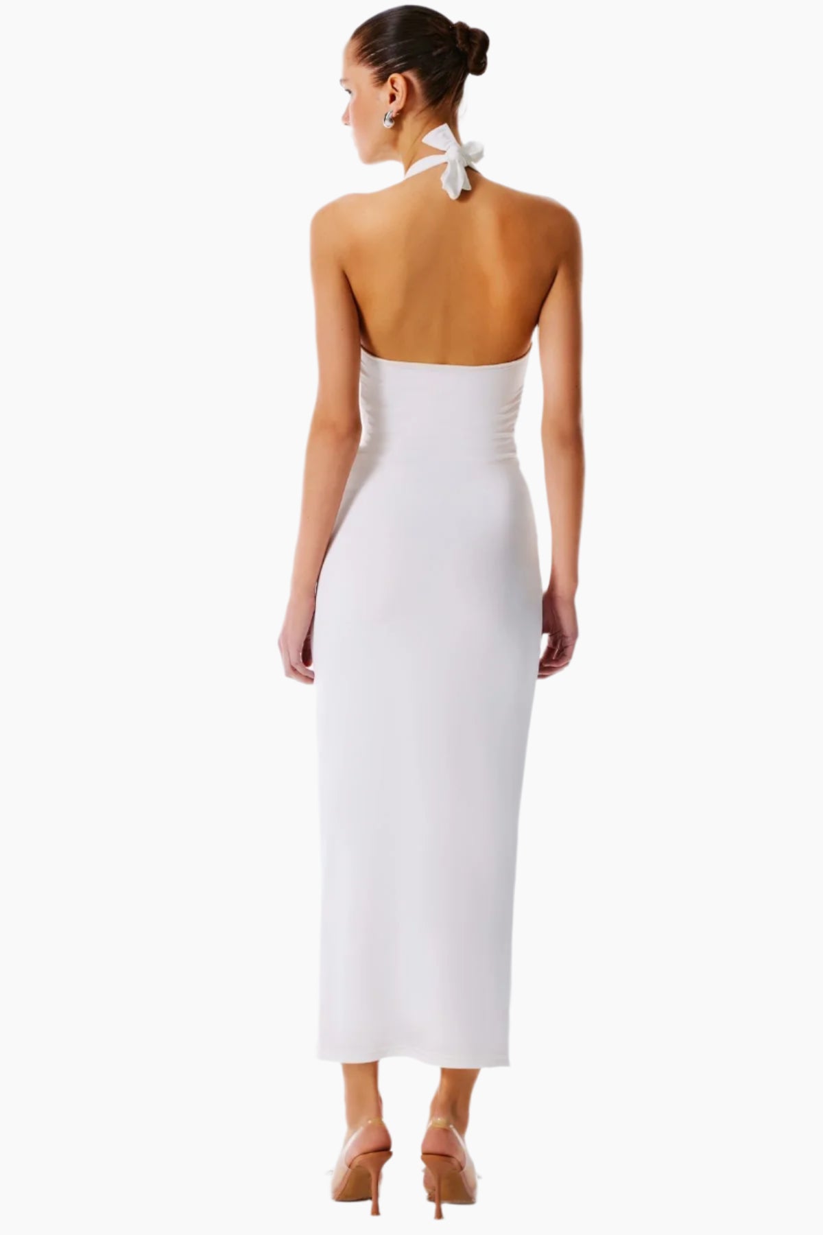 Woman wearing a white halter neck dress