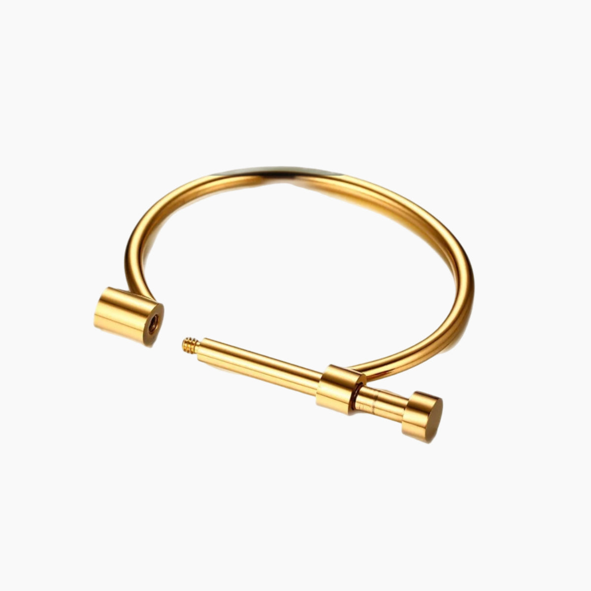 Gold bangle with a cylindrical extension on a white background