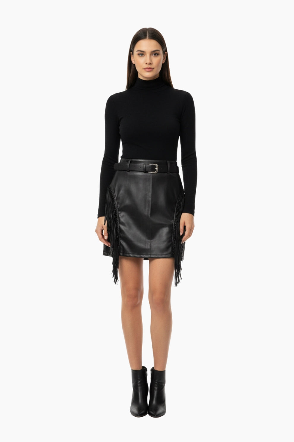 Woman wearing a black turtleneck and leather skirt