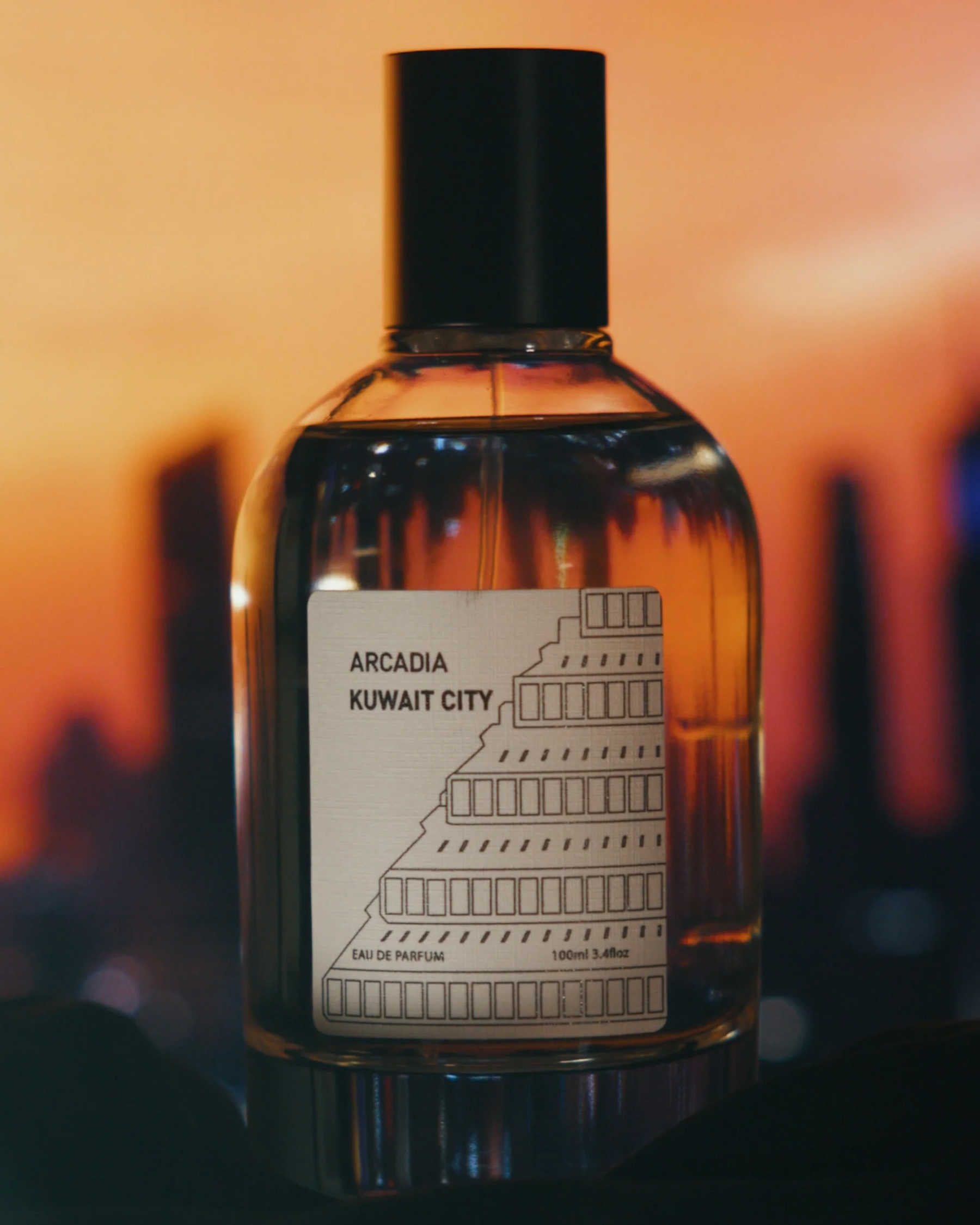 Perfume bottle with a small image of smoke and leaves, sandalwood, patchouli, cedarwood, musk, oud accord