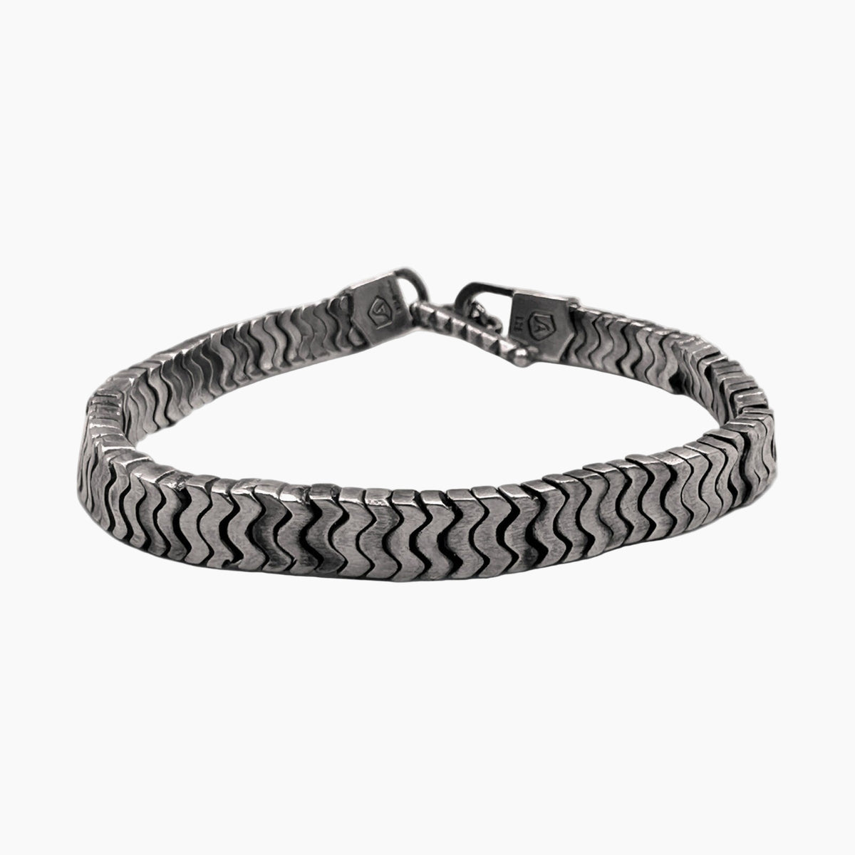 Silver chain bracelet on a white background