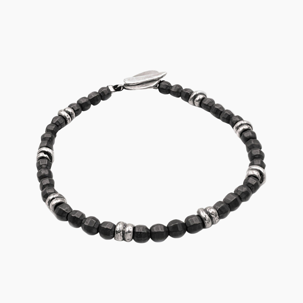 Black beaded bracelet with silver accents on a white background