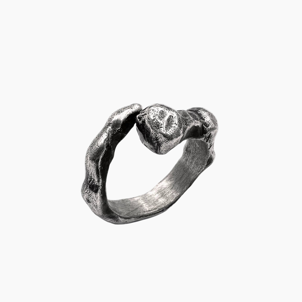 Silver ring with a textured design on a white background