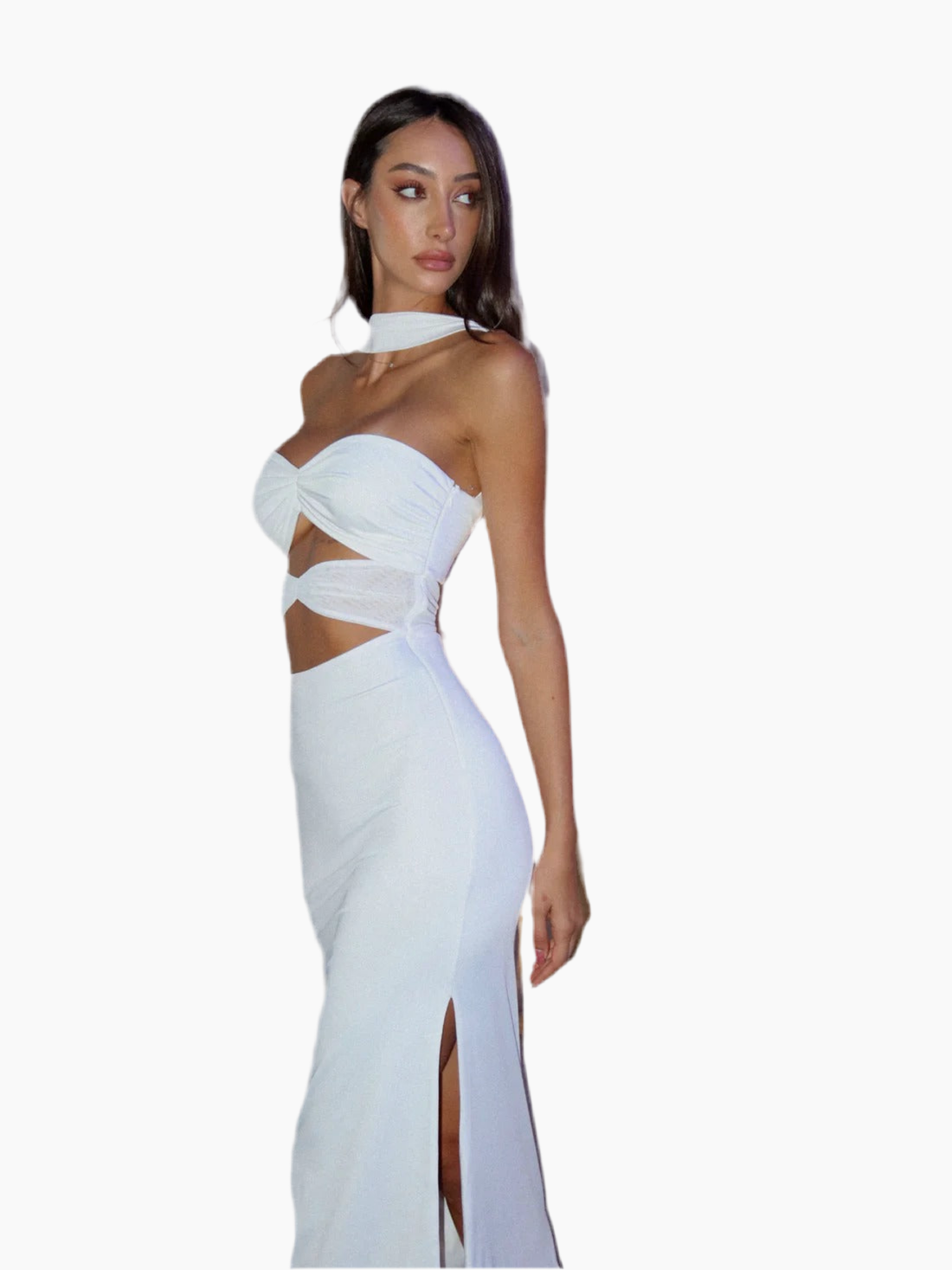 Woman wearing a white evening gown with cut-out design.