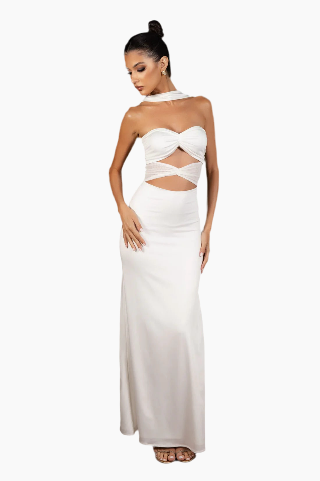 Woman wearing a white strapless gown with cut-out design.