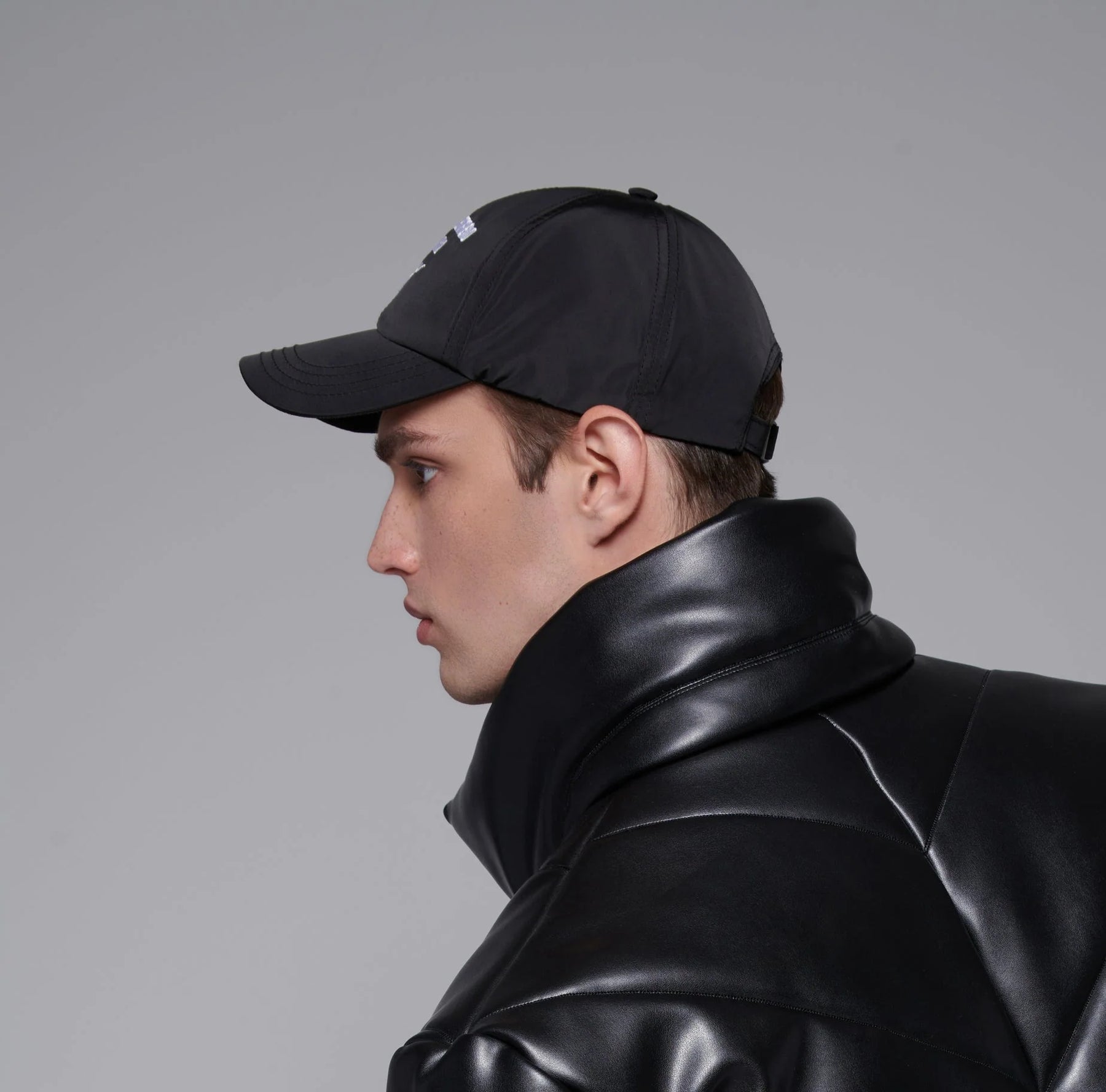 model wearing a Rain-protective baseball hat with a hand-embroidery