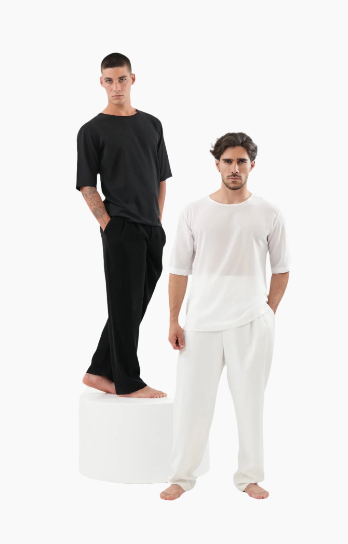 Two men wearing black and white outfits