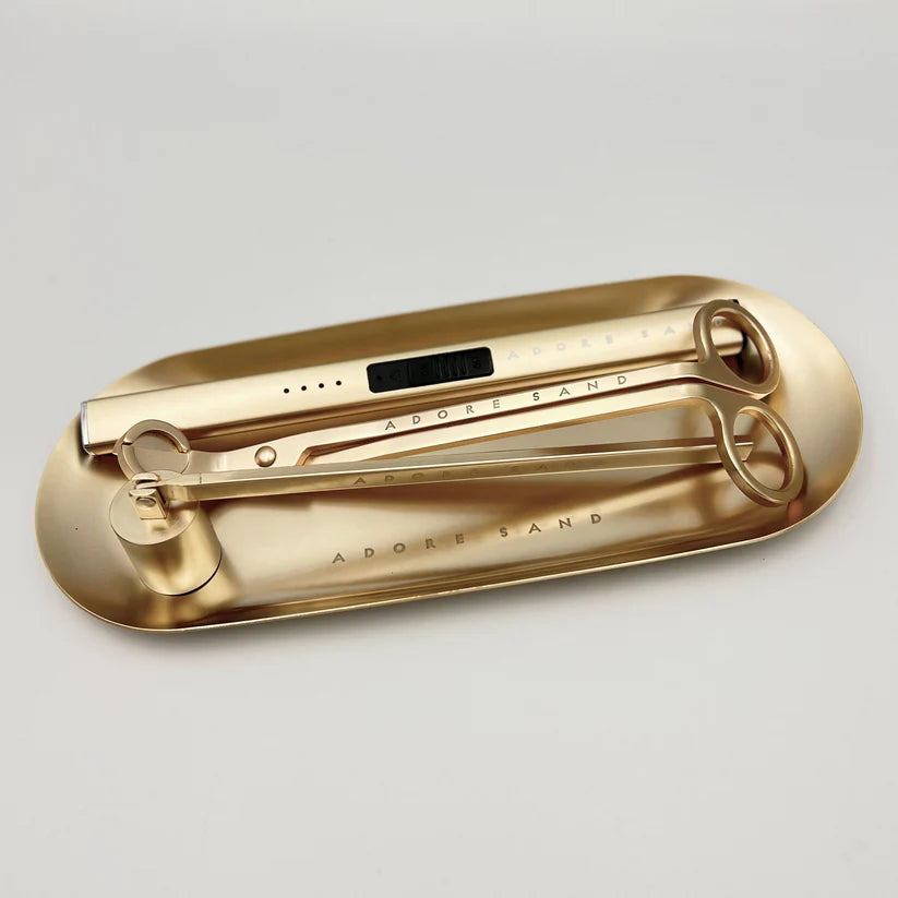 Matte Gold Wick Trimmer: Maintain an even burn and reduce soot by trimming your wicks with precision.
Matte Gold Wick Snuffer: Safely extinguish flames without smoke, ensuring a clean and elegant candle care routine.
Matte Gold Electric Lighter: Rechargeable and sleek, this lighter offers a modern, flameless way to light your candles.
Matte Gold Tray: A sophisticated base to keep your tools organized while adding a touch of elegance to your décor.
Type-C Cable: Conveniently charge your electric lighter for