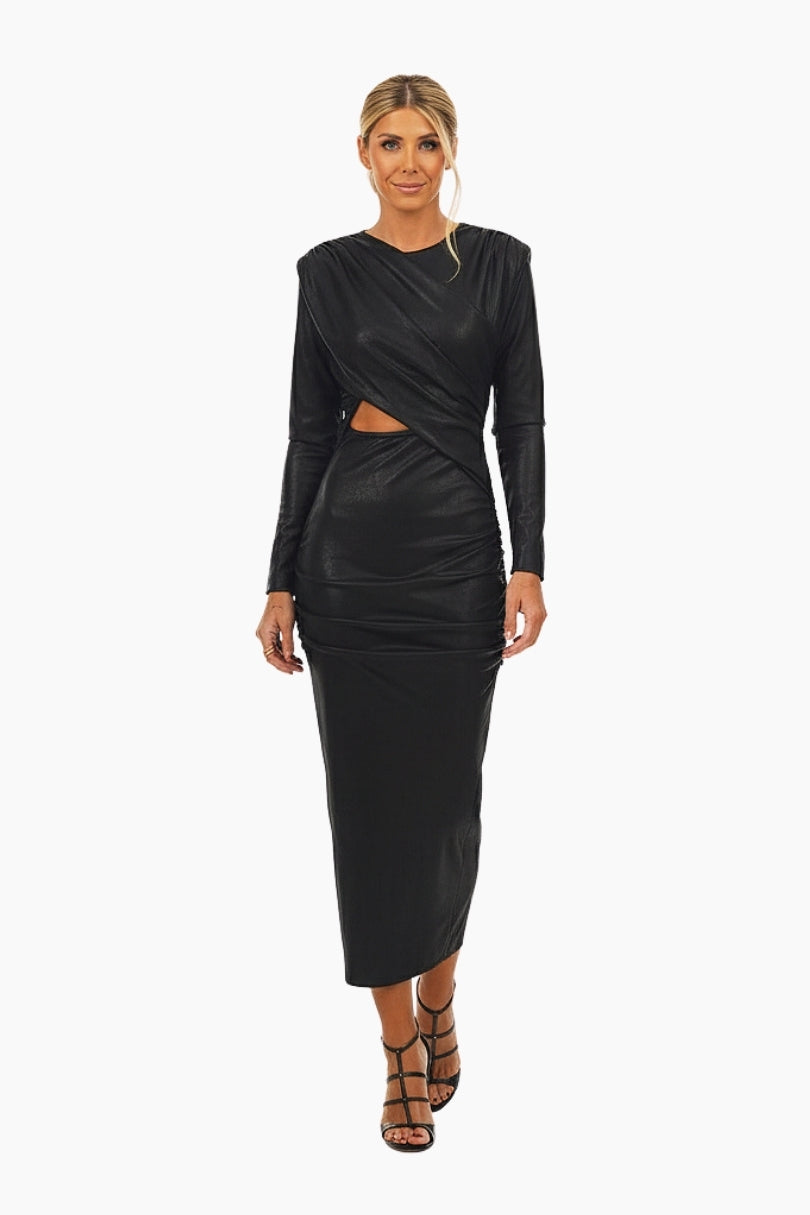 Woman wearing a black long-sleeve dress with cut-out design