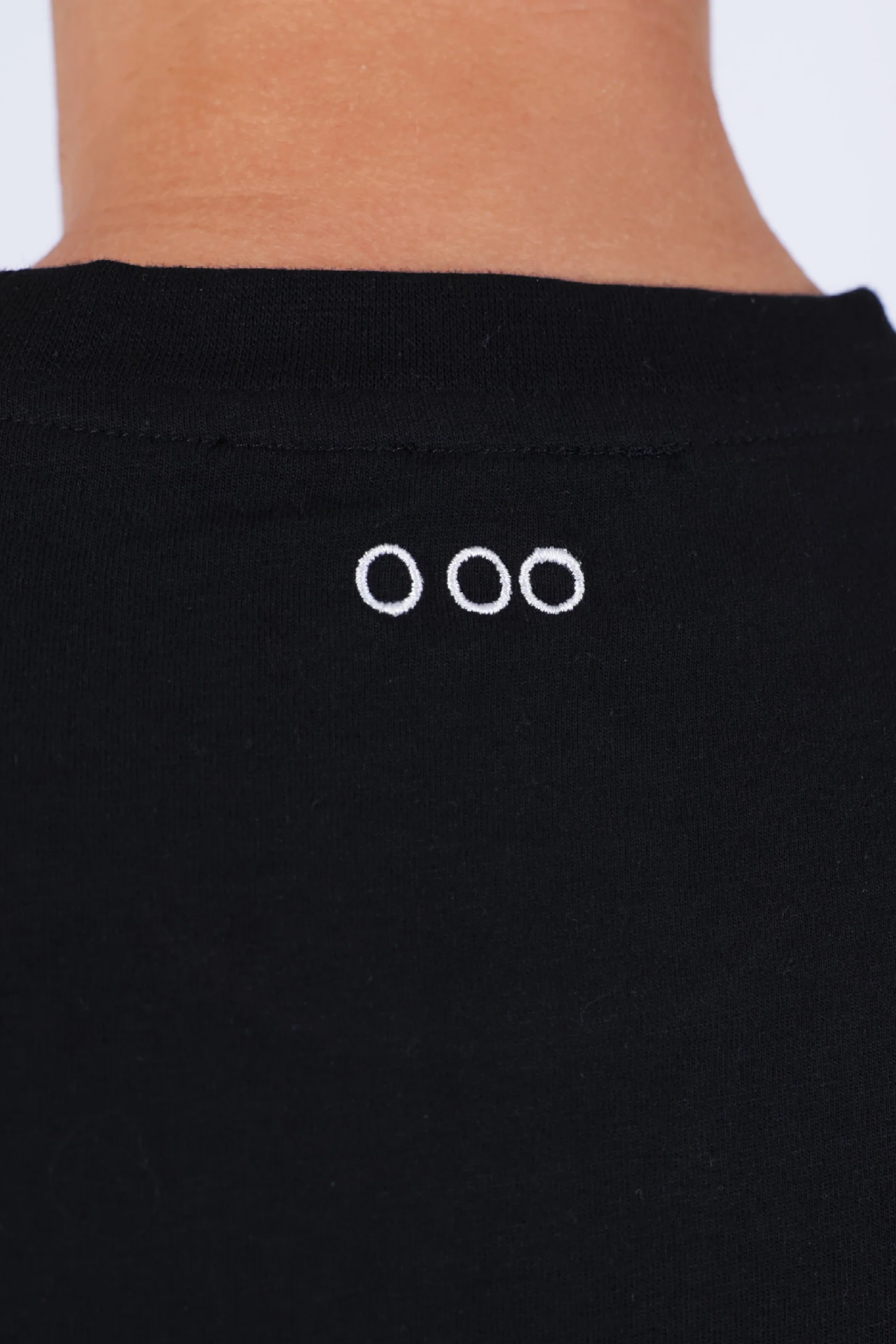 Black garment with white logo