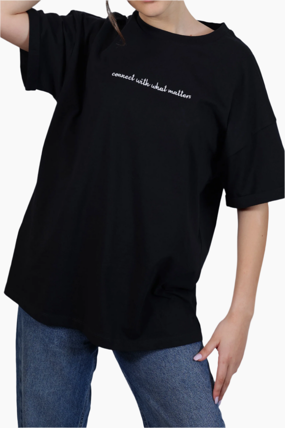 Person wearing a black t-shirt , "Connect with what Matters "T-Shirt ,Unisex