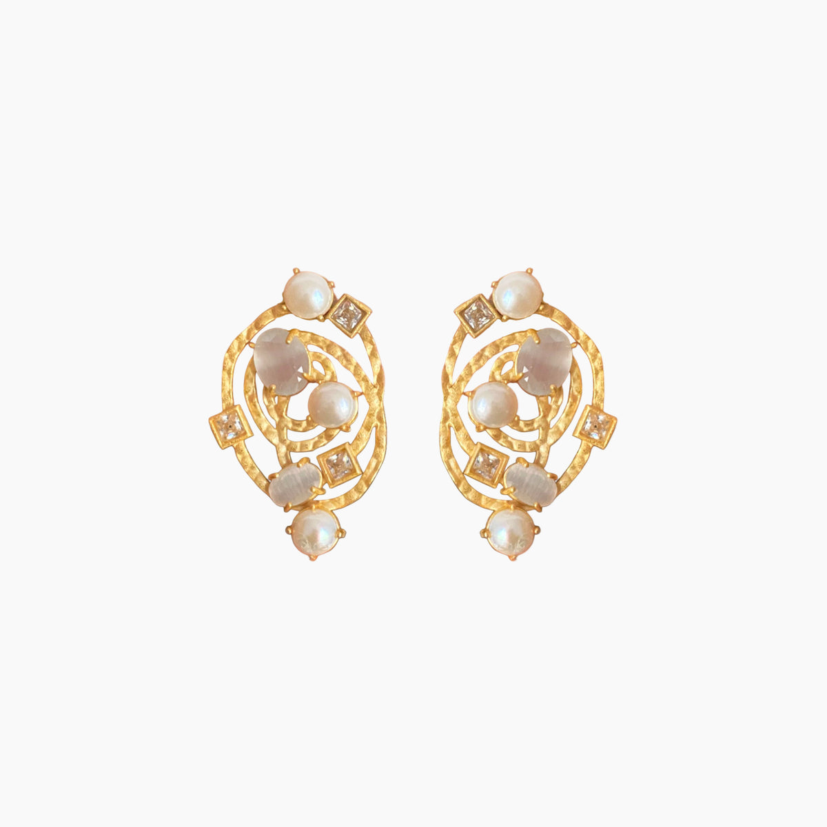 Pair of gold earrings with pearls on a white background