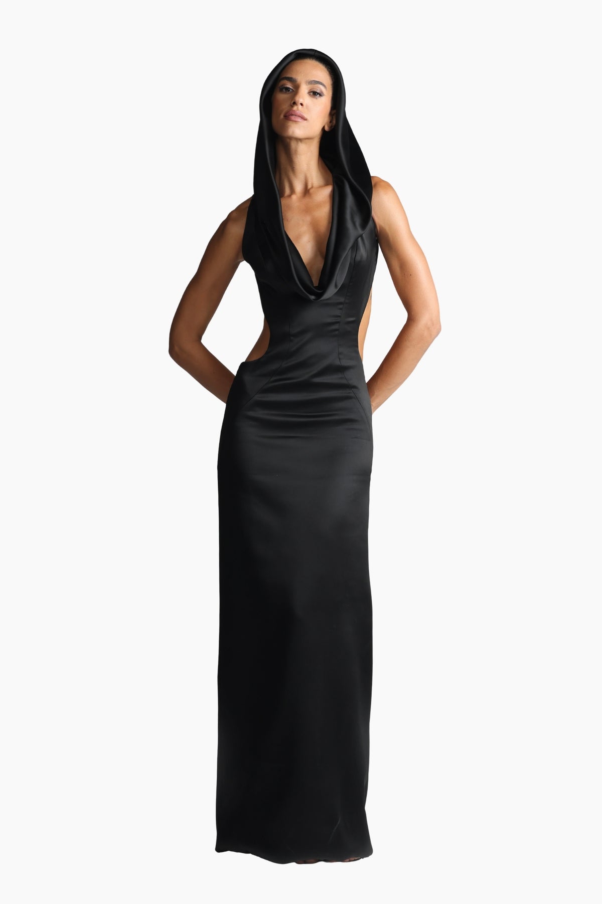 Woman wearing a black evening gown on a white background