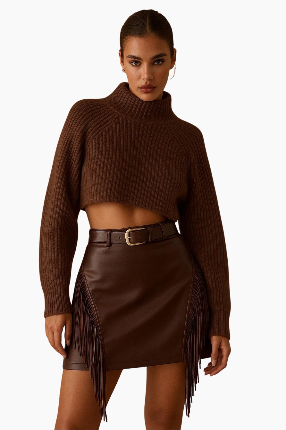 Woman wearing a brown ribbed sweater and leather fringe skirt