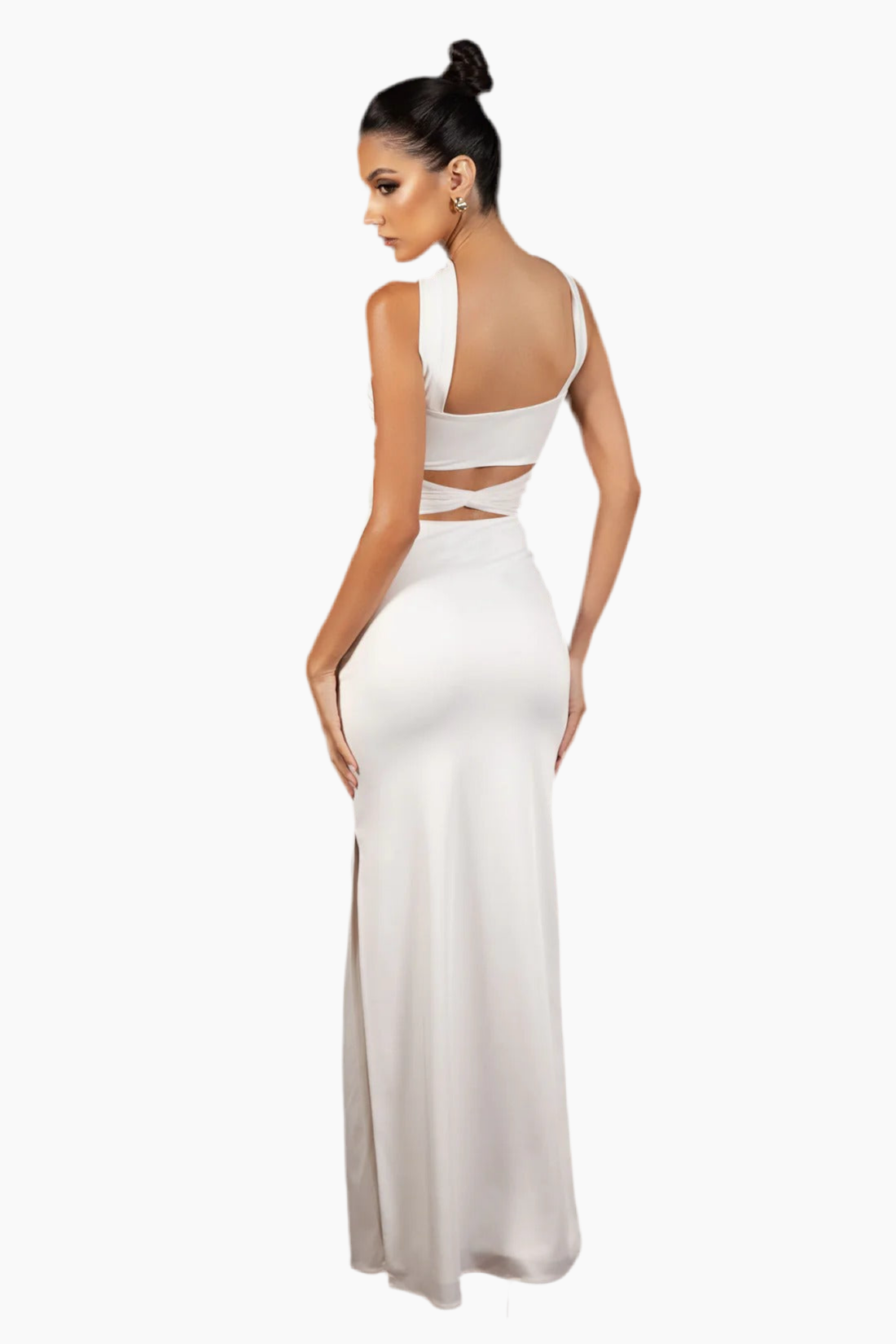 Woman wearing a white dress with cut-out design.