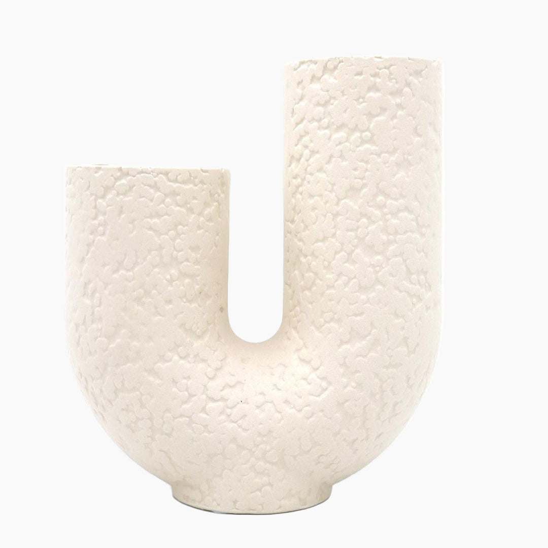 White textured letter 'U' on a white background