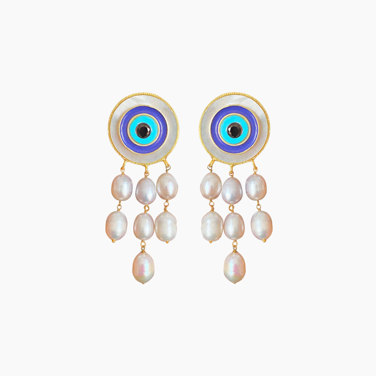 Pair of earrings with circular designs and pearl-like beads on a white background
