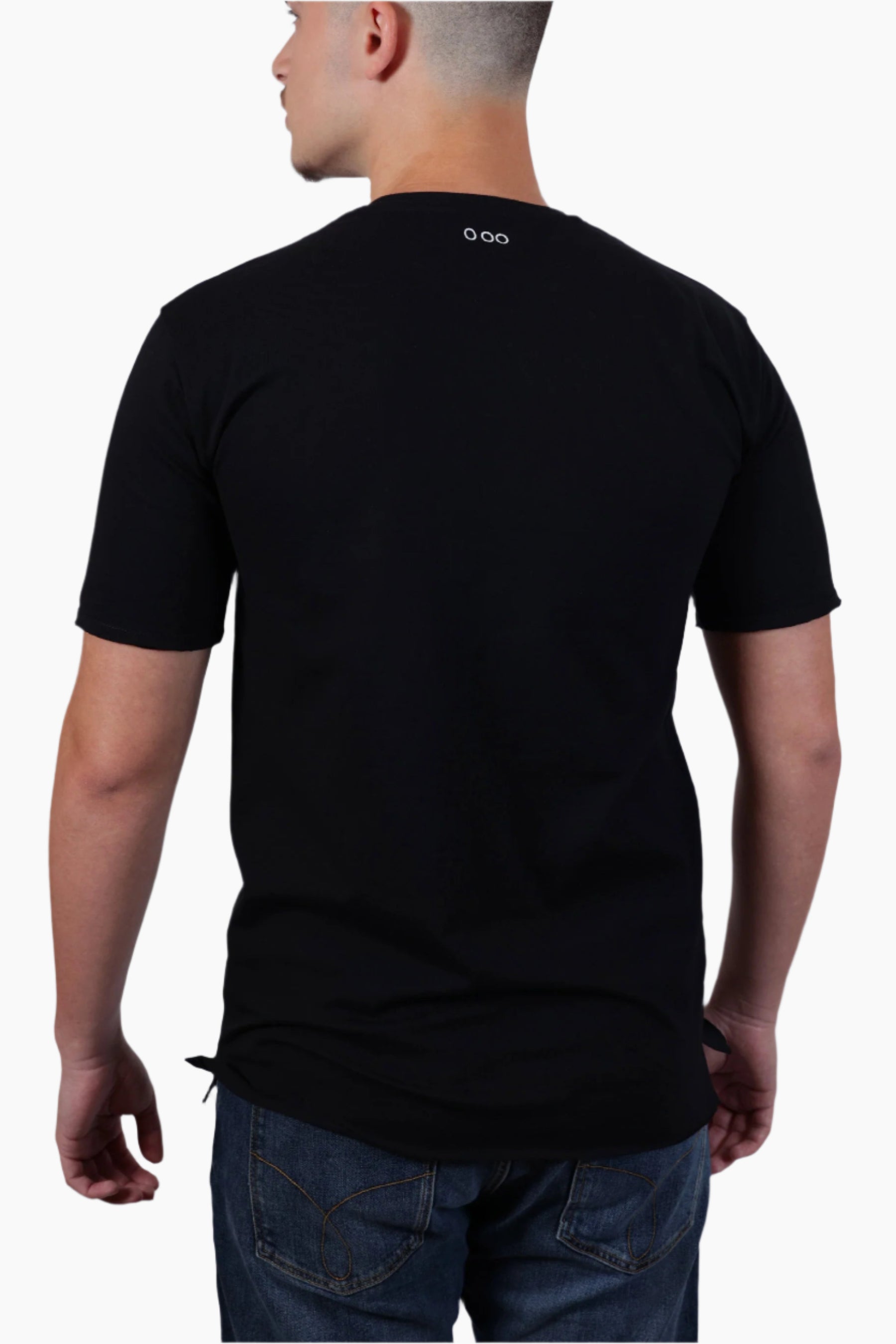 Man wearing a black t-shirt with a logo on the back