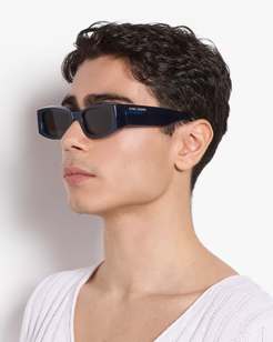 Man wearing black sunglasses with a white background