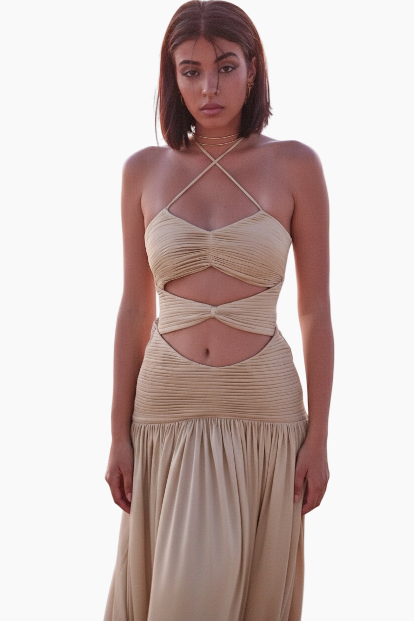 Woman wearing a beige dress with cut-out design