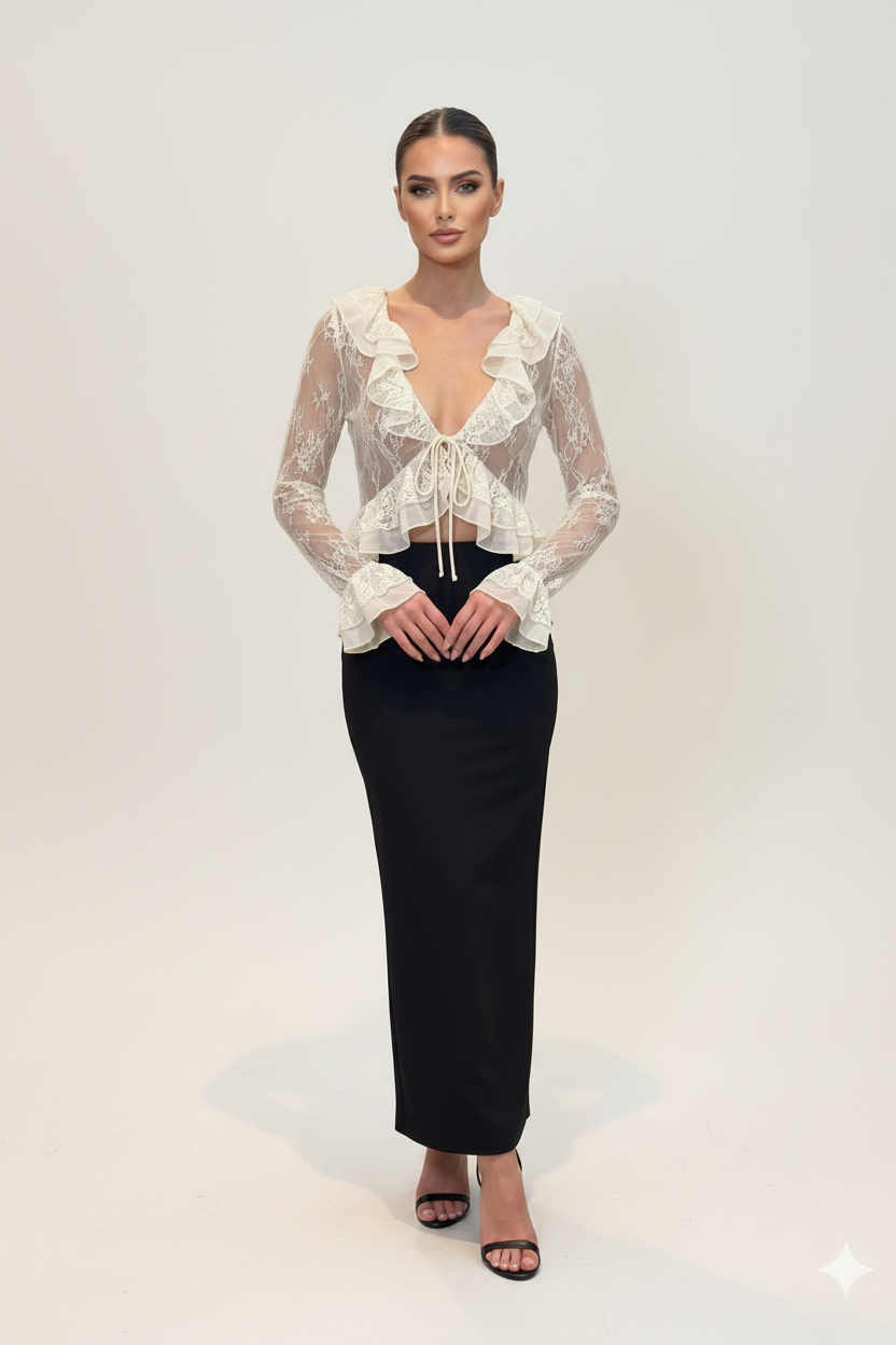 Woman wearing a lace top and black skirt on a white background