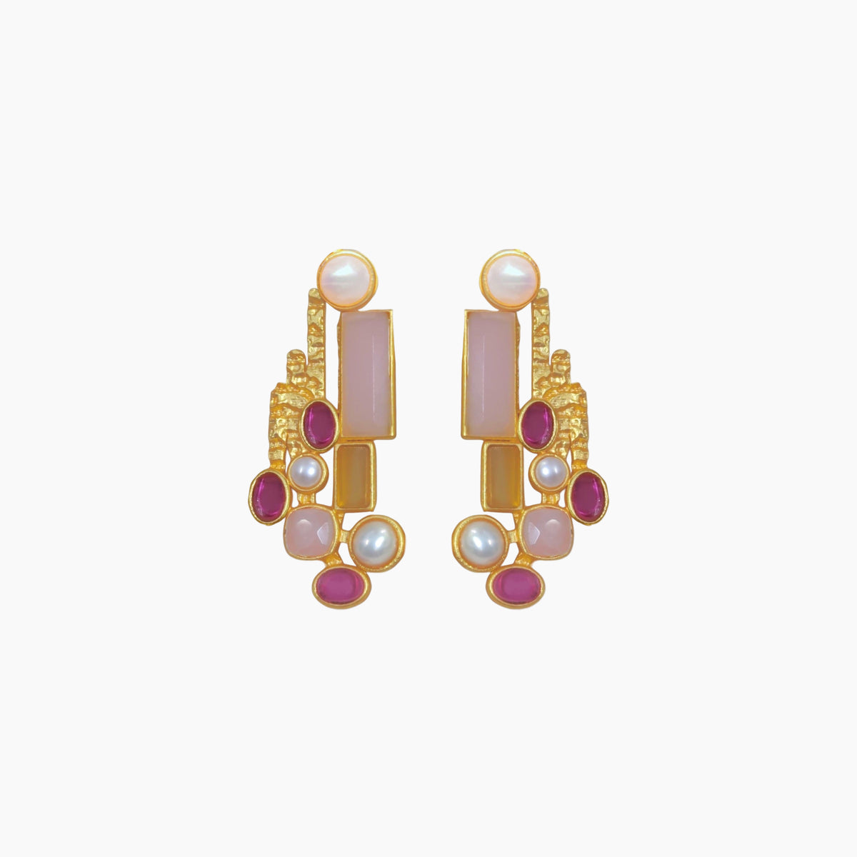 Gold earrings with pink and red stones on a white background