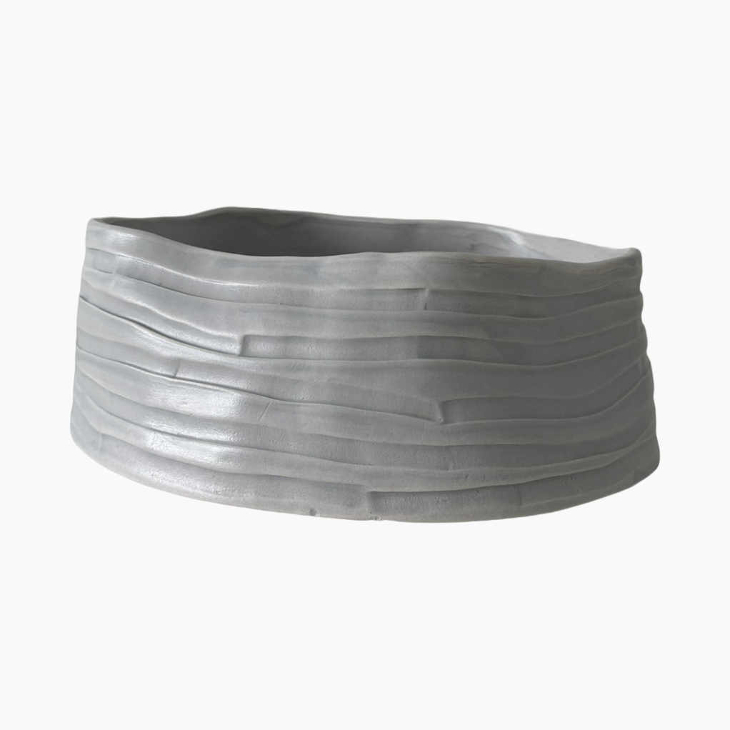 Gray woven basket on a white background
