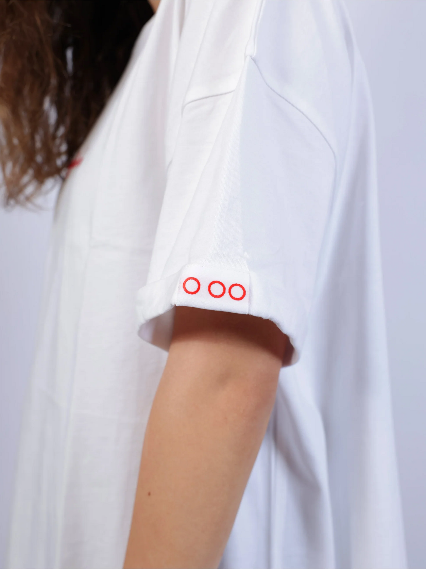 white t-shirt with a logo
