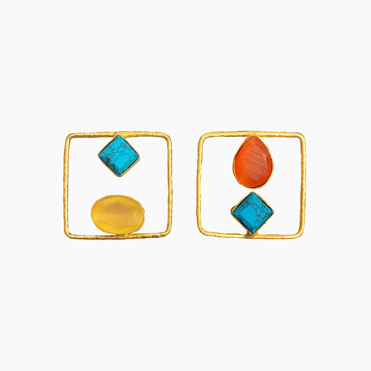 Pair of earrings with geometric shapes on a white background