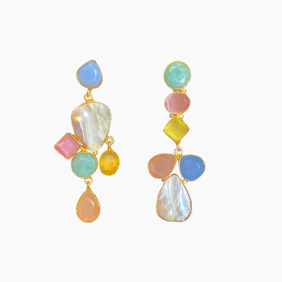 Colorful earrings with various shapes on a white background