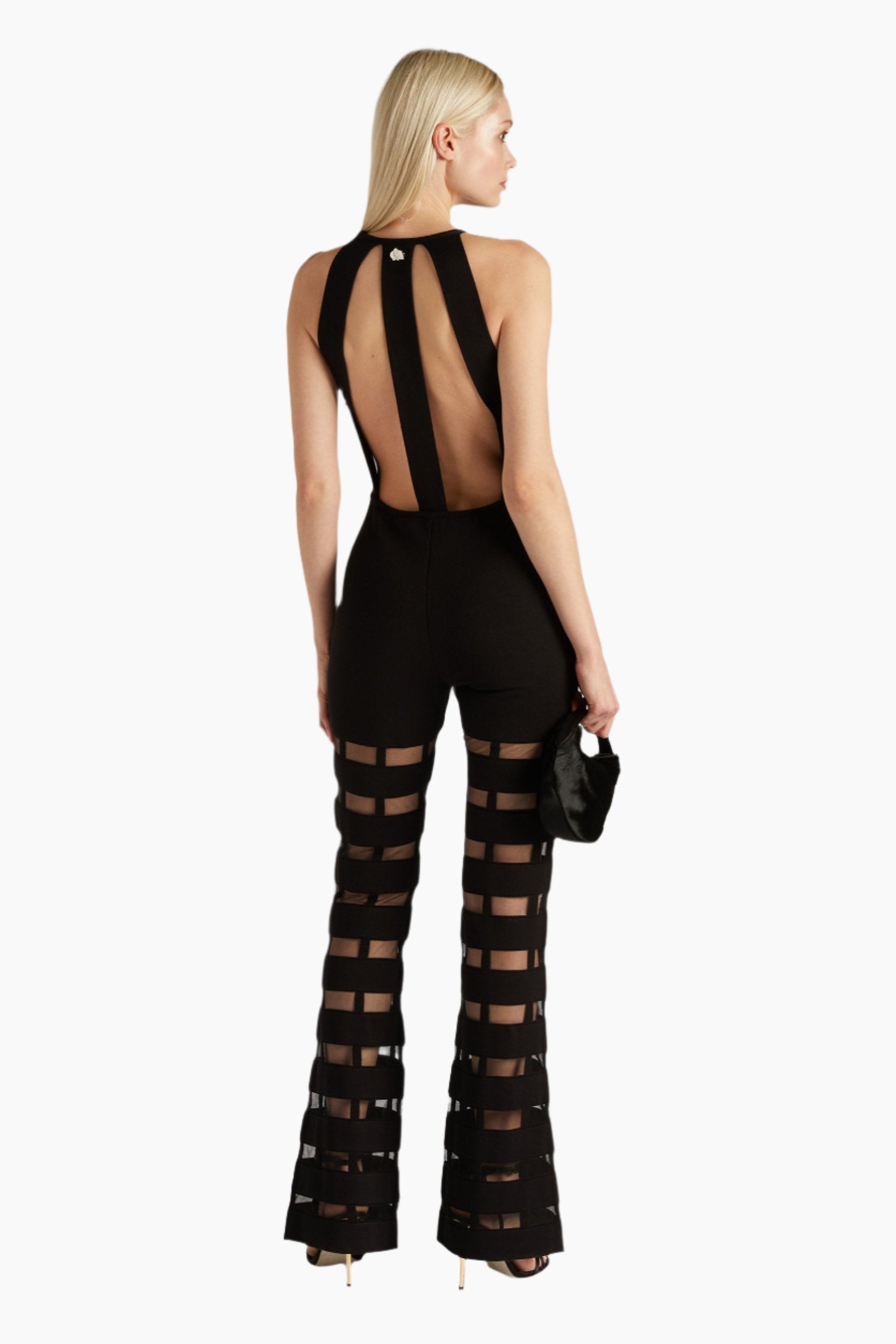 Woman wearing a black outfit with cut-out design