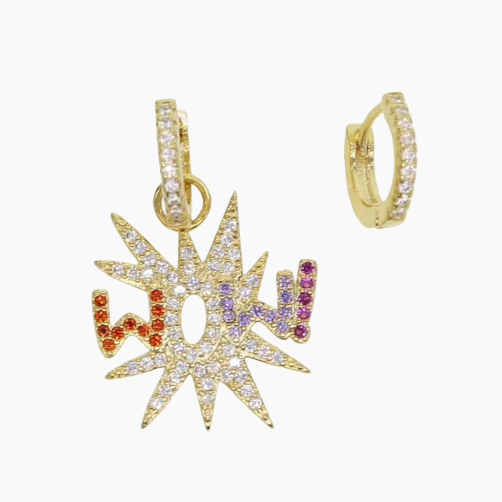 Gold star-shaped pendant with colorful stones on a white background