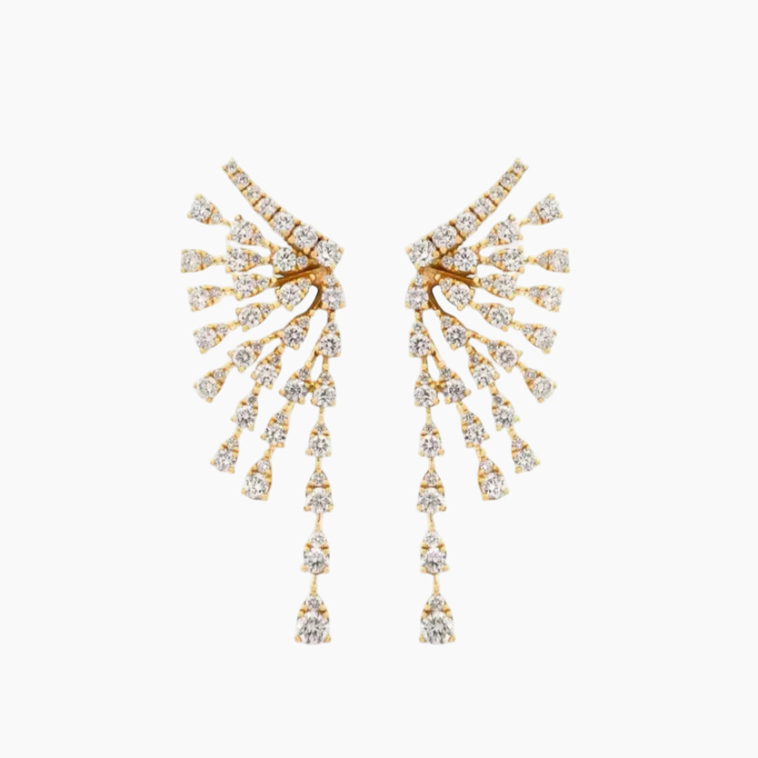 Gold earrings with diamond-like stones on a white background