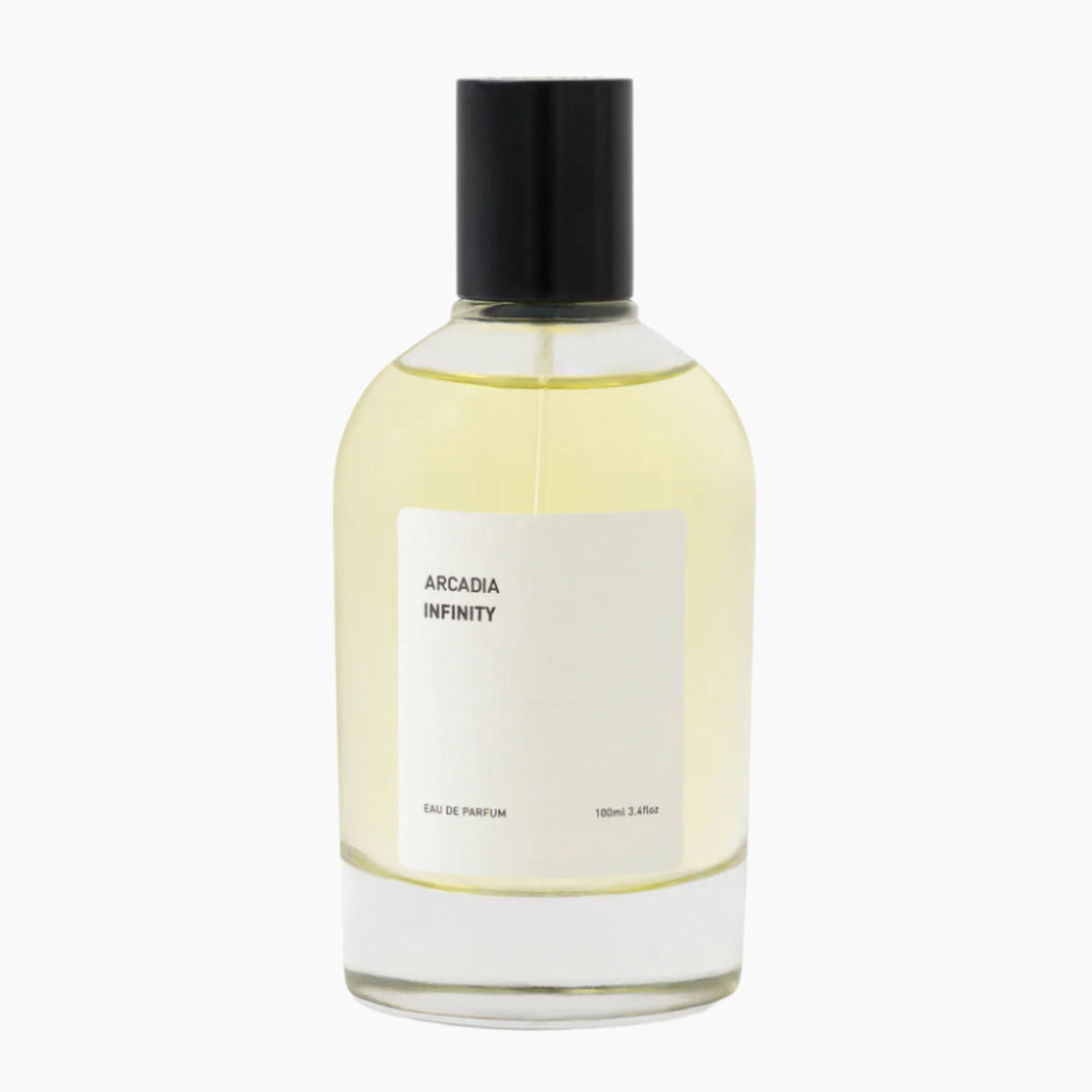 Perfume bottle labeled 'Arcadia Infinity' with images of pineapple, flower, and berries . dry-amber, oud, ambergris, raspberry and sandalwood.