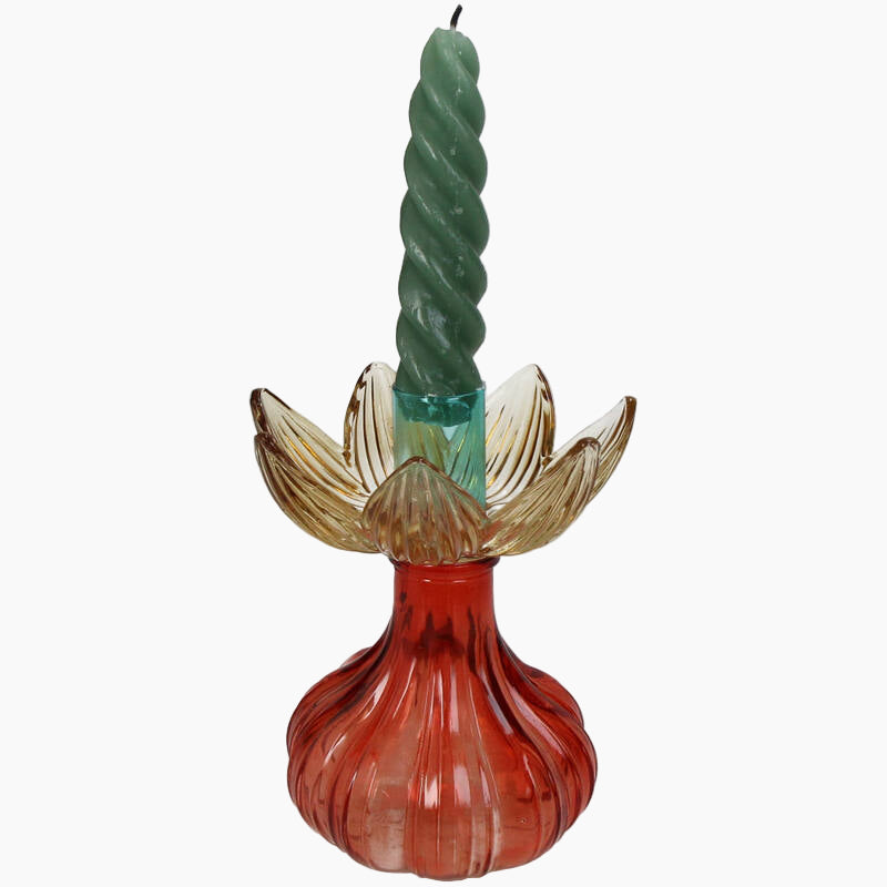 Decorative candle holder with a twisted green candle