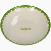 Ceramic bowl with green rim and 'Jadore' text on