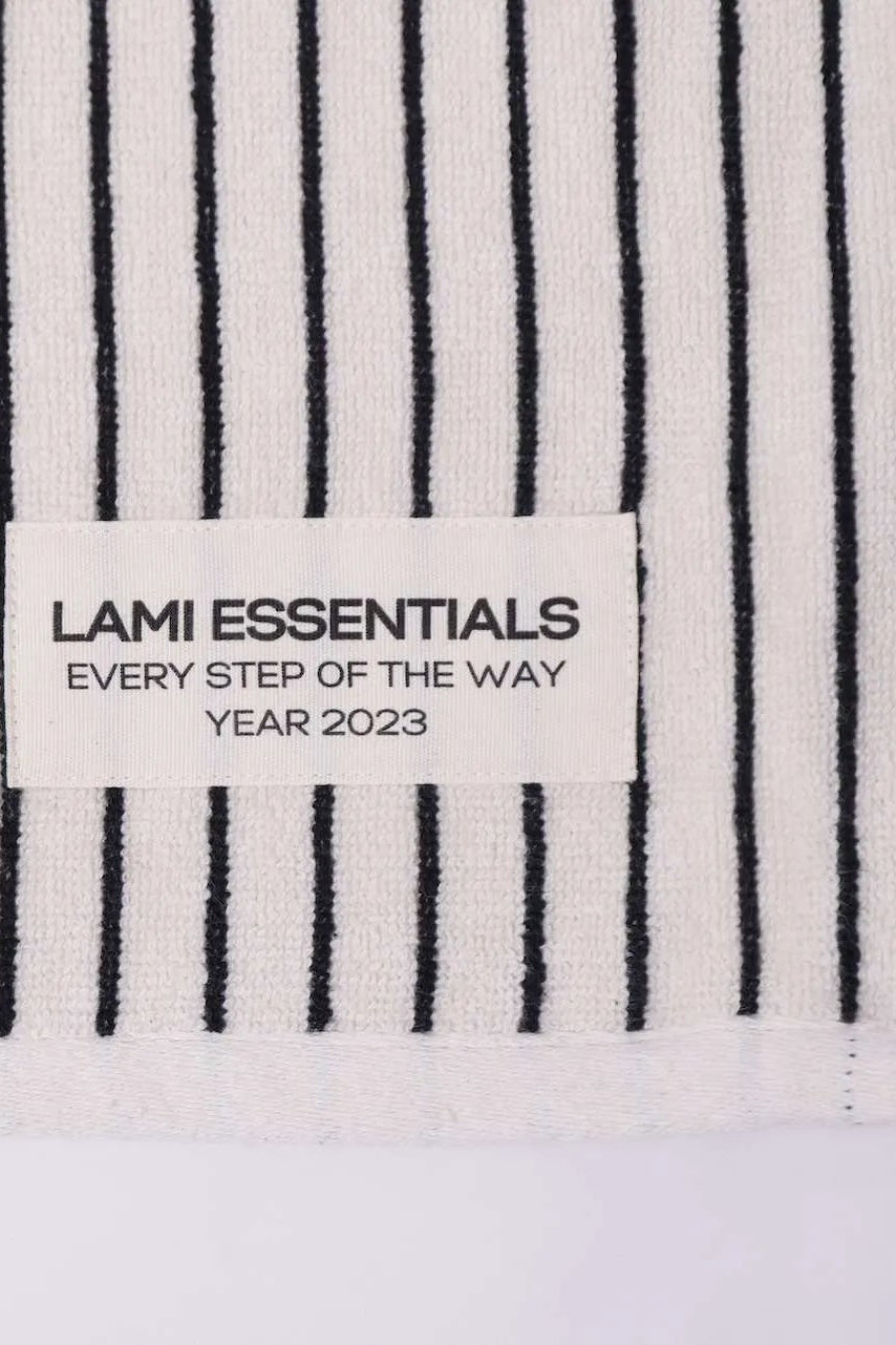 Striped fabric with a Lami Essentials label on a white background