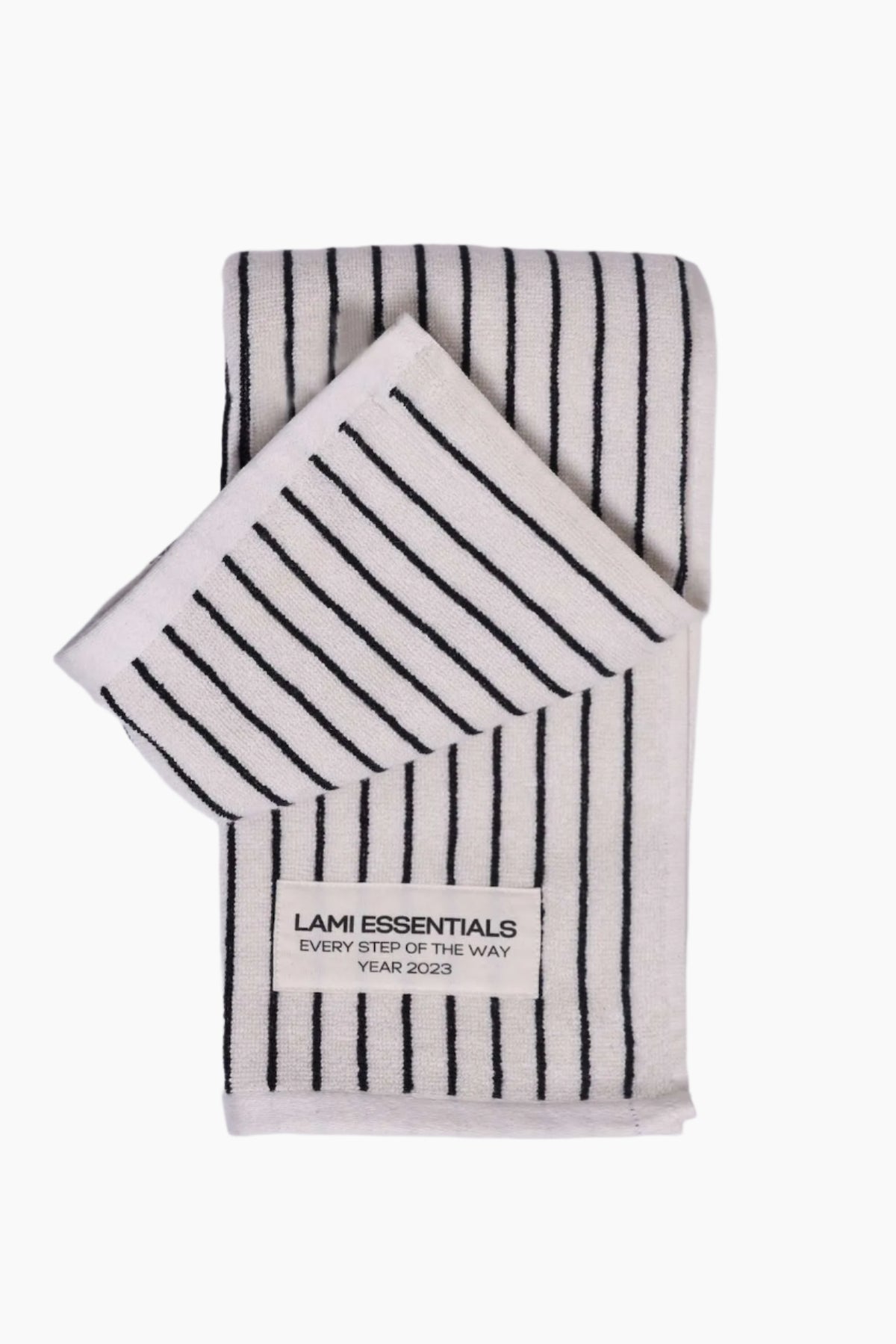 Two striped towels with 'Lami Essentials' branding