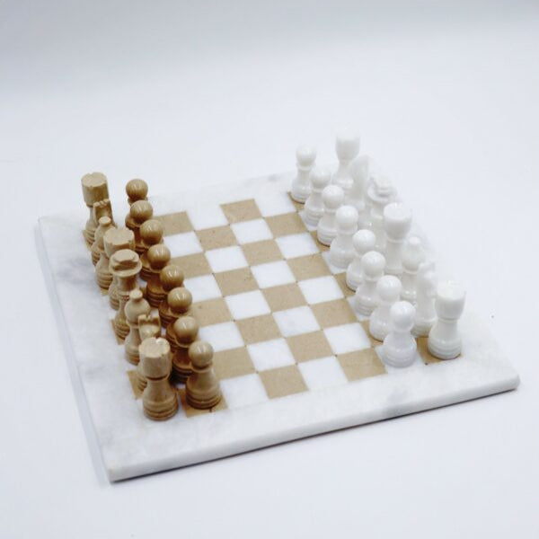 Wooden chess set with white and brown pieces on a checkered board.