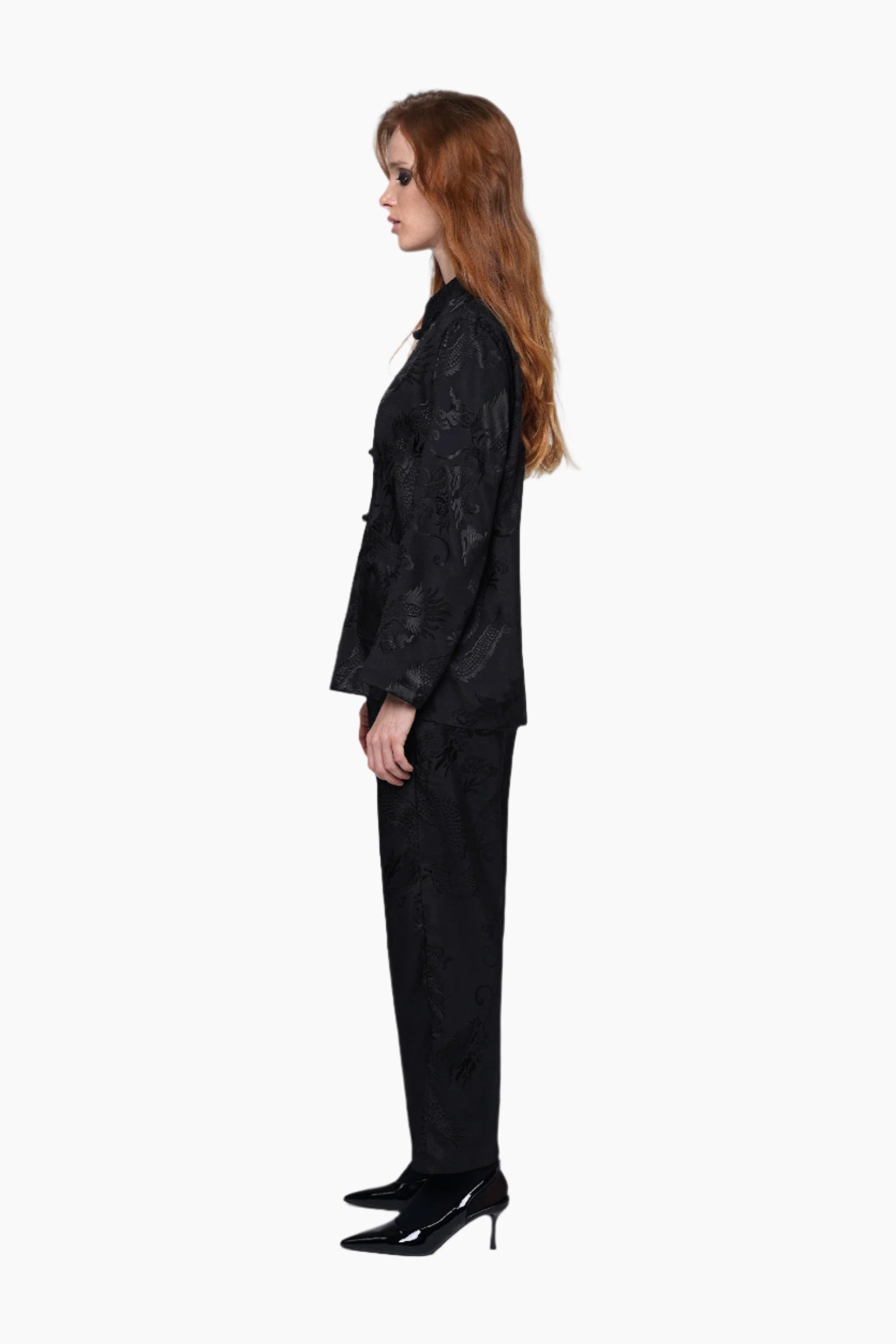 Woman wearing a black textured suit