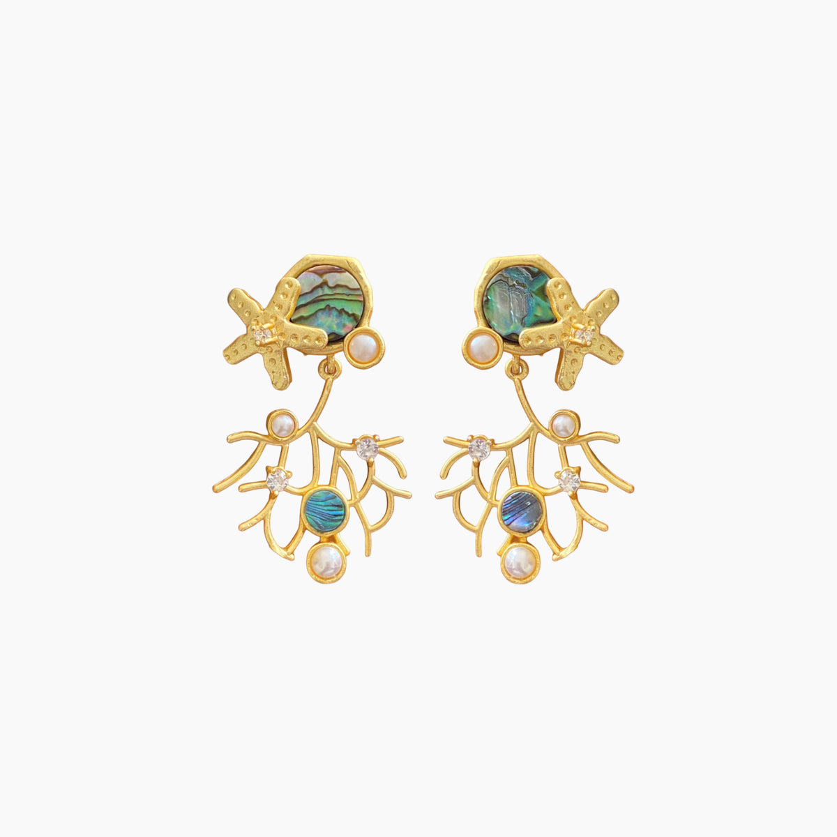 Gold earrings with starfish and gemstone designs on a white background