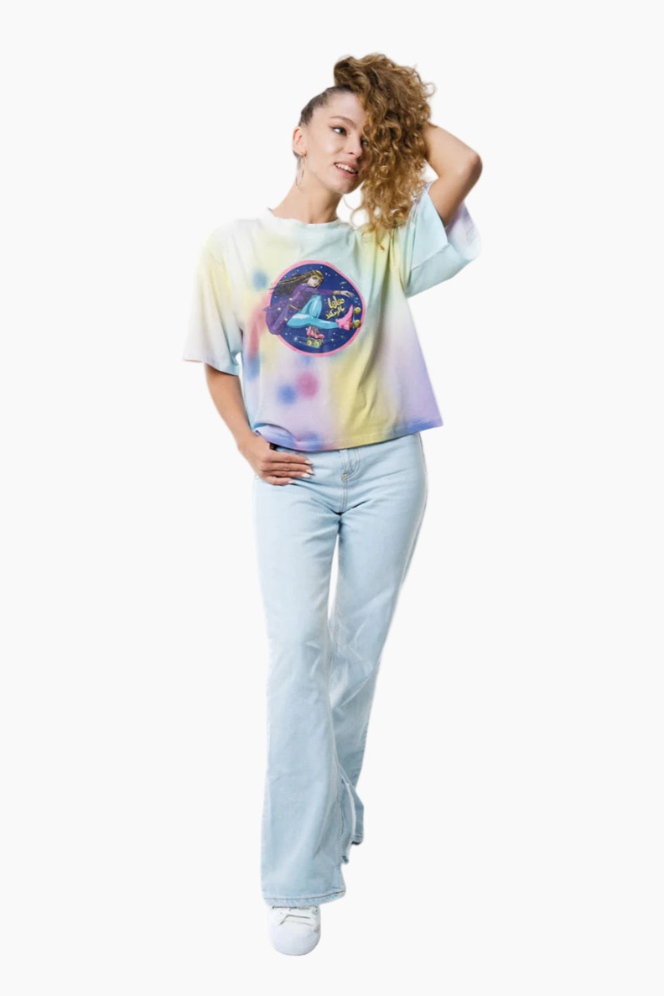 Woman wearing a tie-dye shirt with a graphic design on a white background