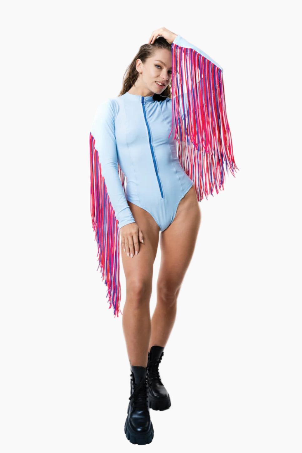 Model wearing a blue bodysuit with pink fringe
