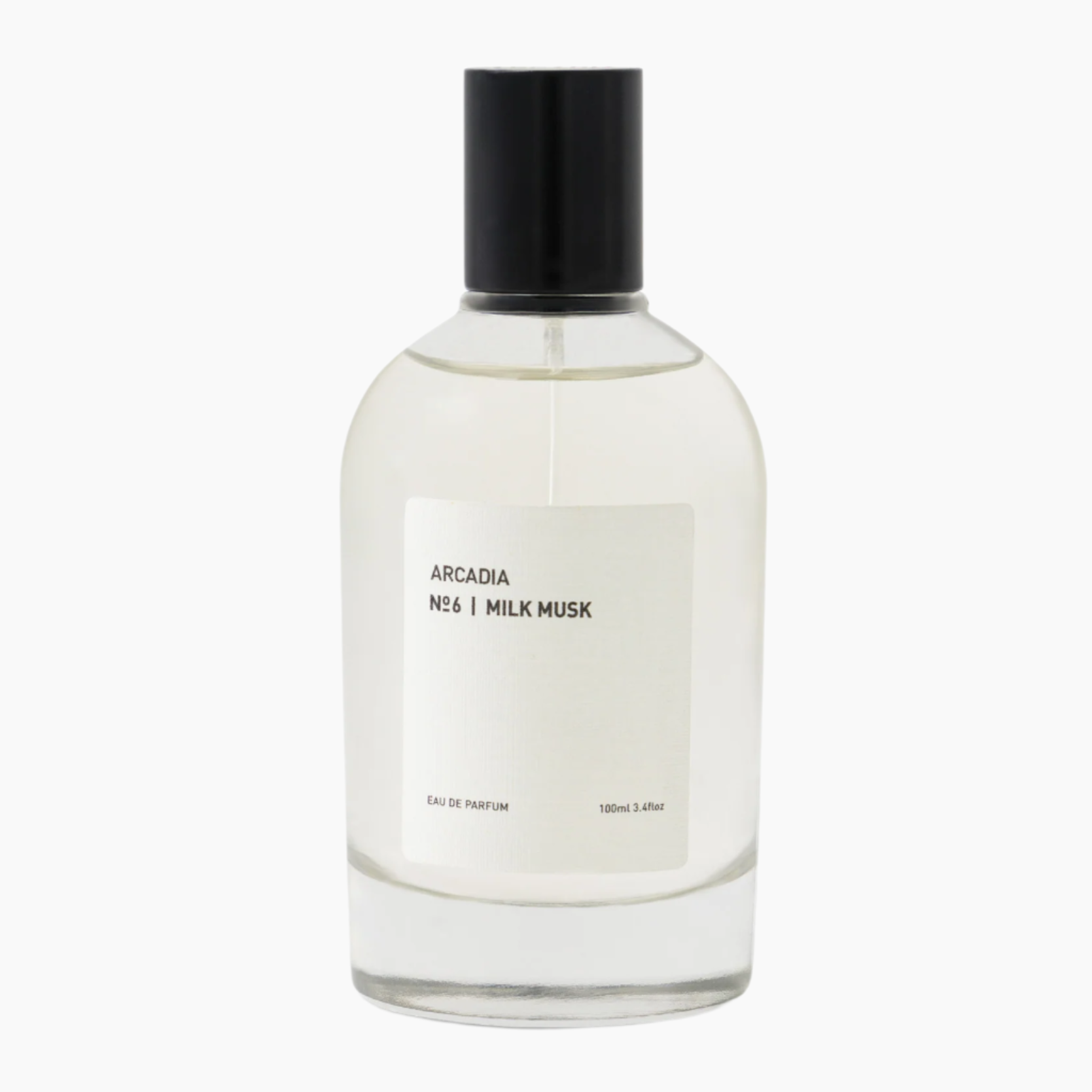 Clear perfume bottle with black cap labeled 'Arcadia No. 6 Milk Musk'