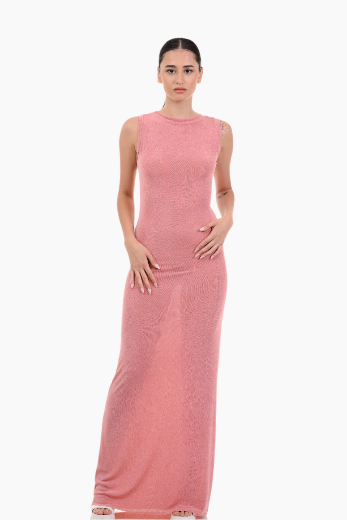 Woman wearing a pink sleeveless dress