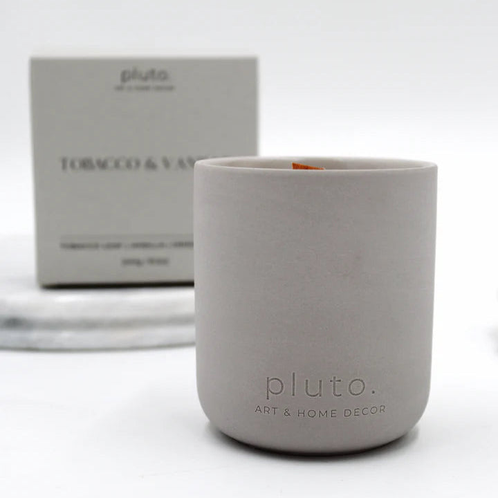 Gray candle with 'pluto' branding