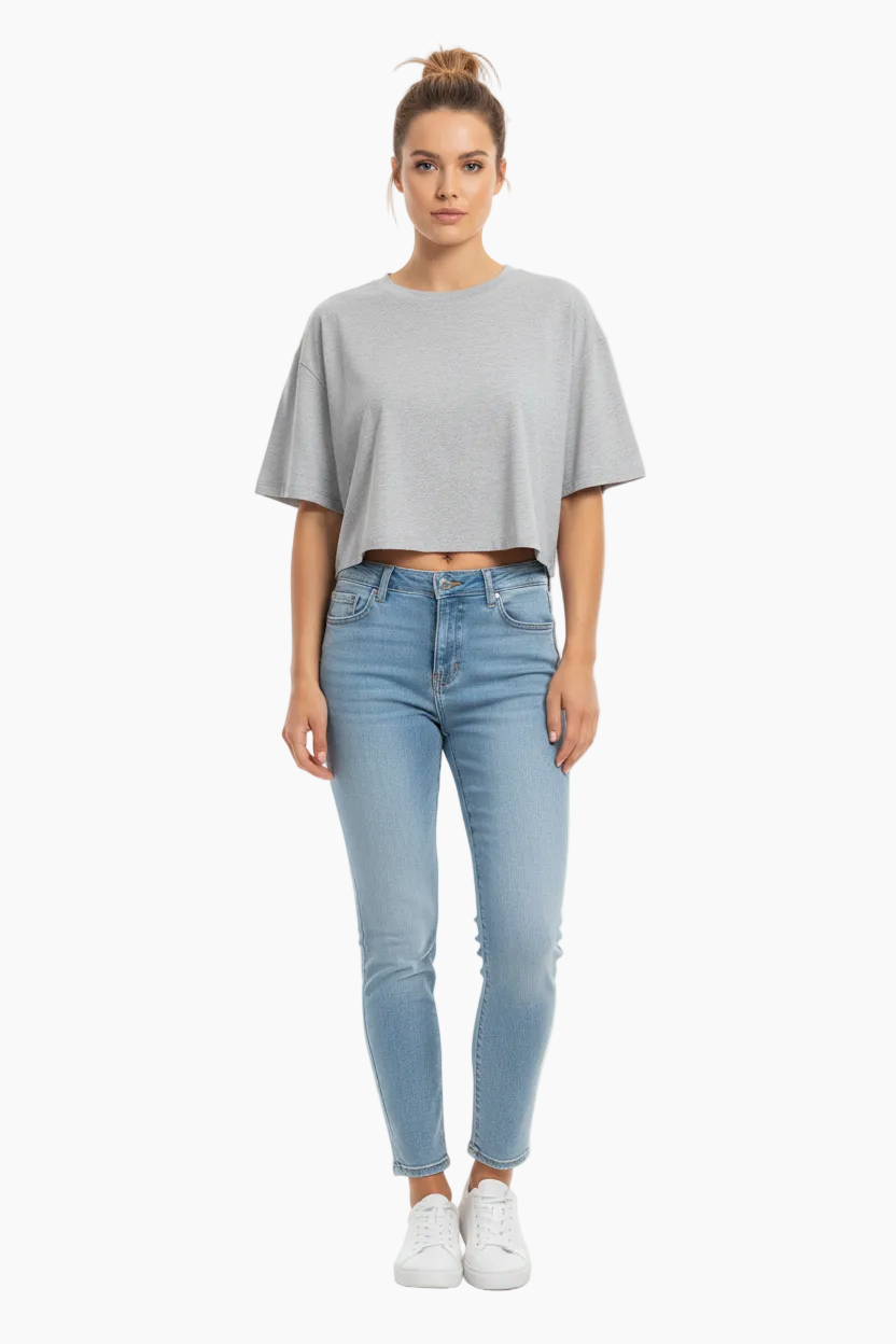 Gray crop top on a wooden hanger against a white background