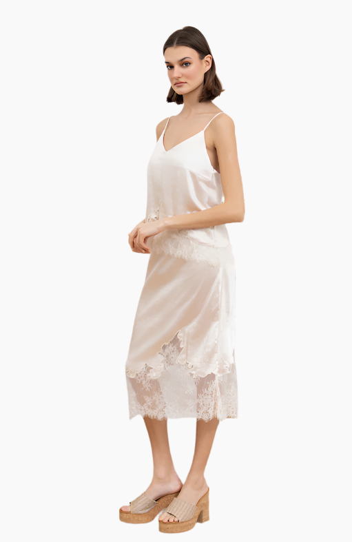 Woman wearing a white lace slip dress